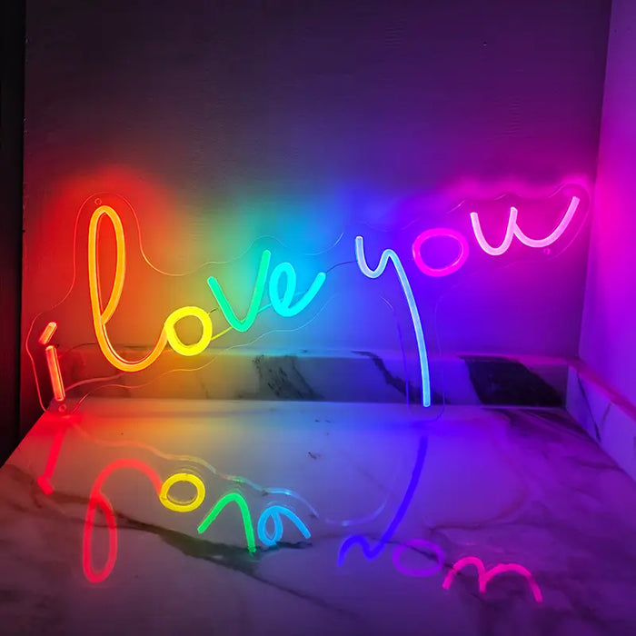 I Love You Neon LED Sign on the wall above a marble surface, the lettering reflecting in the slab