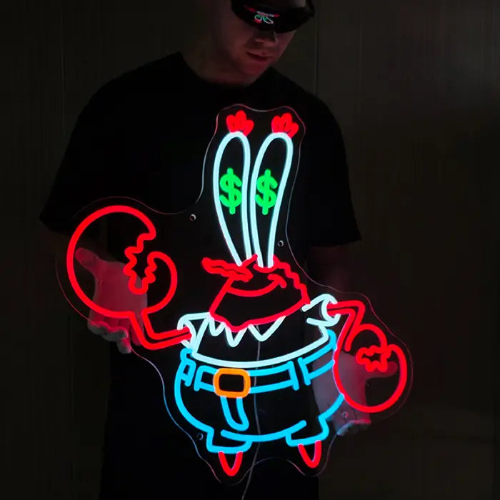 Krebs Neon LED Schild frontal im Dunkeln, die beiden Augenstiele mit grünen Dollarzeichen ragen nach oben
