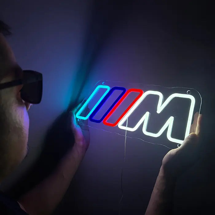 M Stripes neon LED sign, shot from the side, contour-cut acrylic panel visible