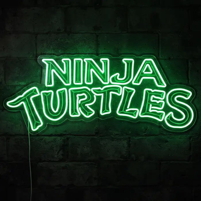 Ninja Turtles Set Neon LED Sign design NINJA TURTLES lettering in green on a dark wall