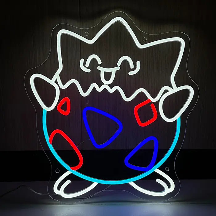 Eierschalen-Figur Neon LED Schild frontal an dunkler Holzwand, weiße Kontur mit roten und blauen Dreiecksflecken
