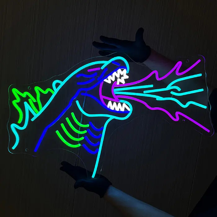 Godzilla Neon LED Sign aligned on the wall, one hand holding the acrylic panel from above