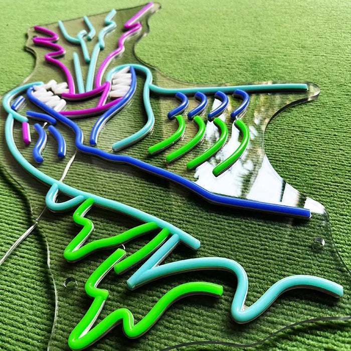 Godzilla Neon LED Sign switched off in close-up, back plates and the acrylic edge