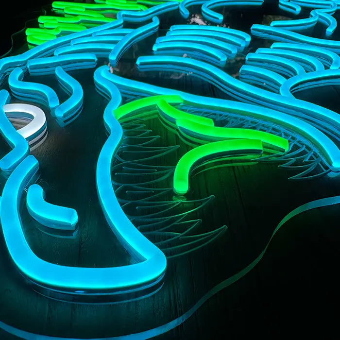 Godzilla Neon LED Sign in close-up, blue and green neon tubing on clear acrylic