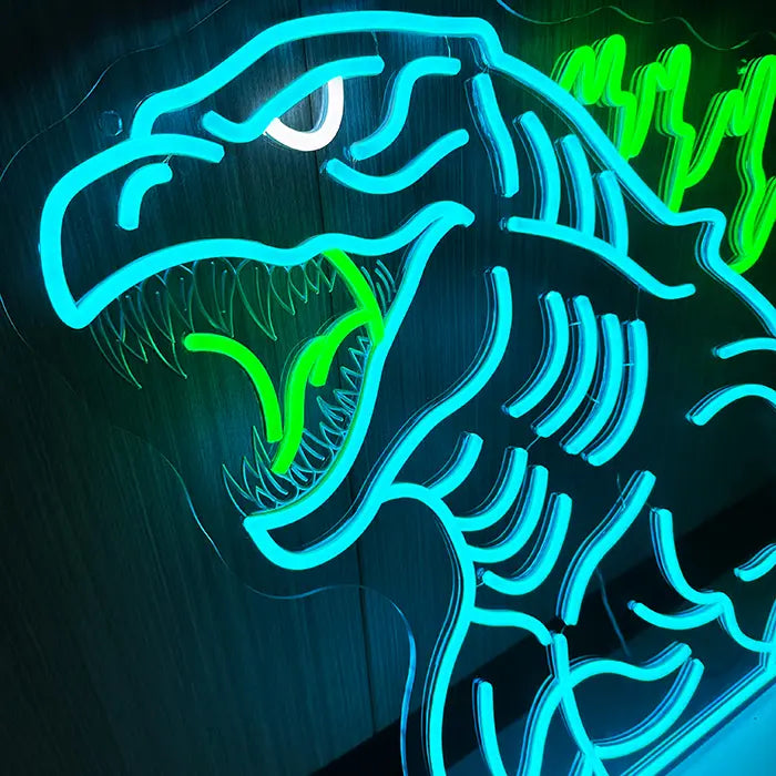 Godzilla Neon LED Sign in close-up on a wooden wall, head and mouth glowing strongly