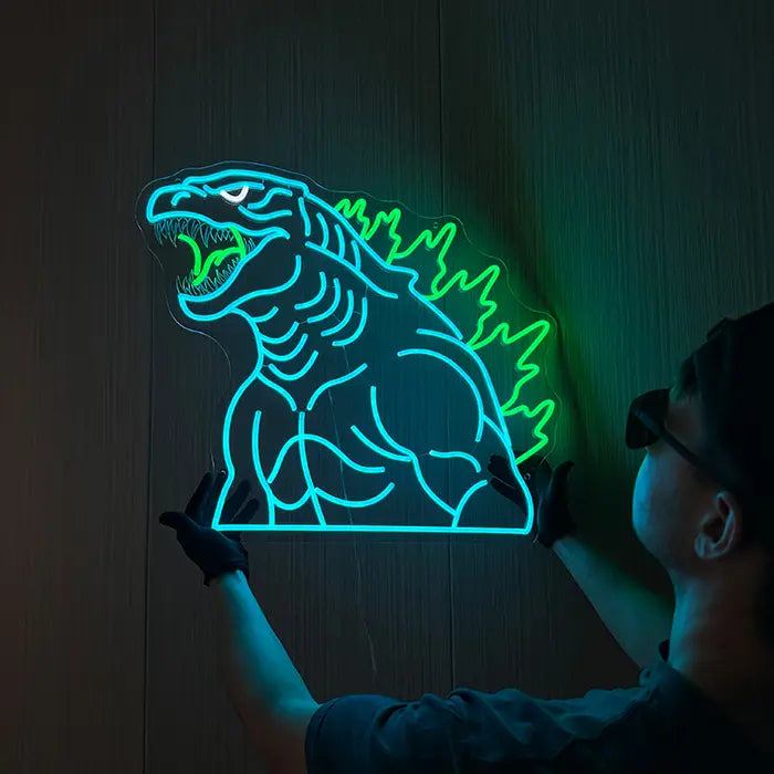 Godzilla Neon LED Sign, Power of the Green Flame motif: mounted on the wall, a person holding it