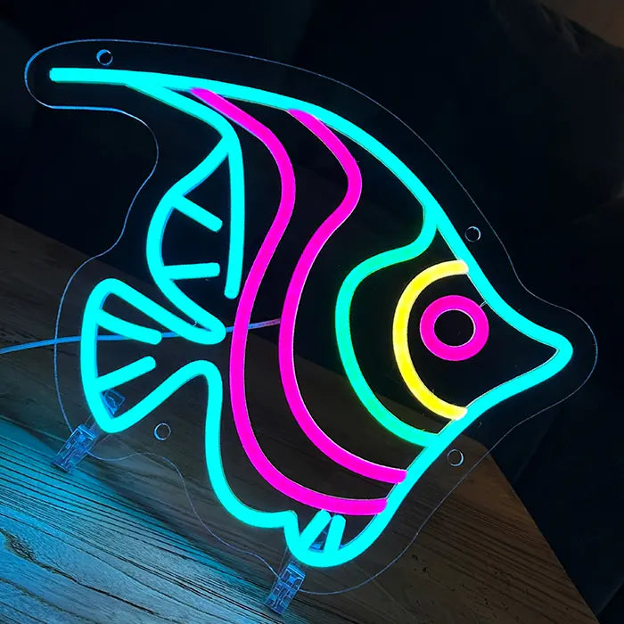 Ocean Fish Neon LED Sign glowing head-on, fins and stripes in turquoise, pink, green and yellow