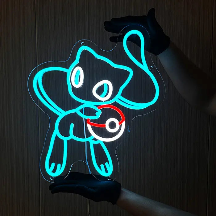Pokémon Mew Neon LED Sign in blue held against the wall with gloves, arms and legs clearly visible