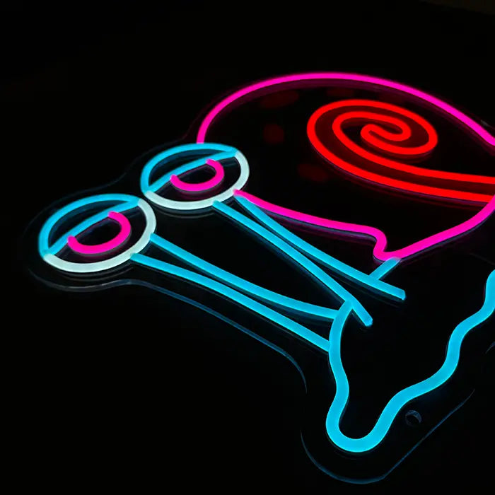 Gary the Snail Neon LED Sign photographed from the side, the eye stalks standing out from the acrylic panel