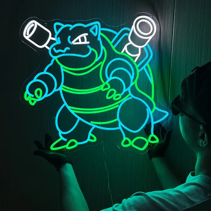 Pokémon Blastoise Neon LED Sign, Space Edition, held against the wall with both hands by a person