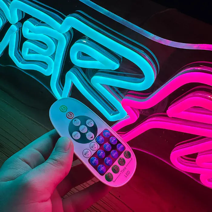 CYBERPUNK Neon LED Sign with the remote in hand, buttons for colours, timer and flash modes