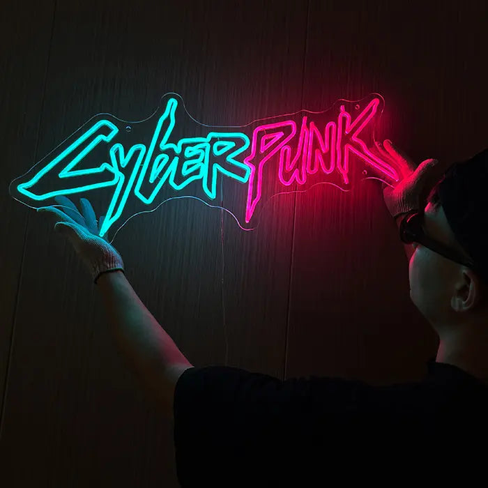 CYBERPUNK Neon LED Sign held against the wall and aligned by a person