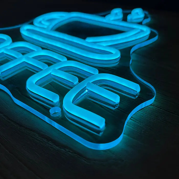 Coffee Cup Neon LED Sign from above at an angle, letters and cup raised on clear acrylic