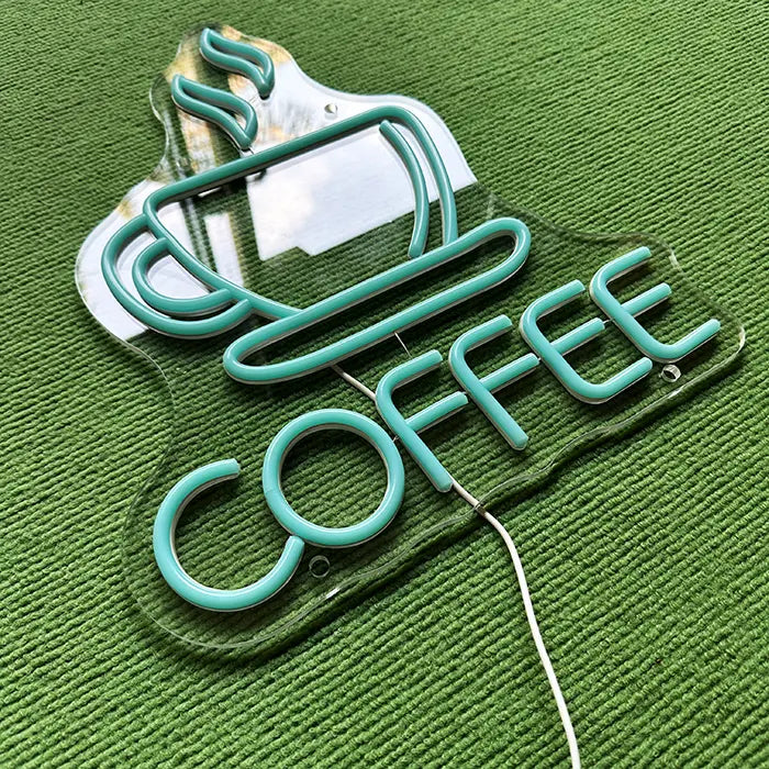 Coffee Cup Neon LED Sign switched off from above at an angle, neon tubes on the acrylic panel