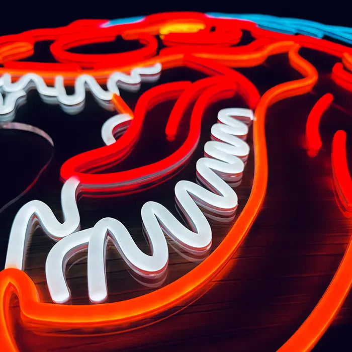T-Rex Dino Neon LED Sign in close-up, open jaws with tongue and white teeth