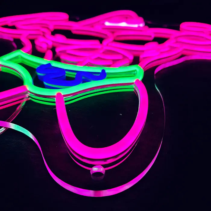 Patrick Bodybuilder Neon LED Sign from the side at an angle, green swim shorts with blue pattern