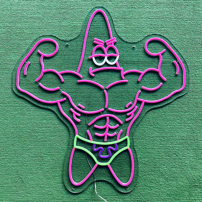 Patrick Bodybuilder Neon LED Sign switched off on a green surface, full outline visible