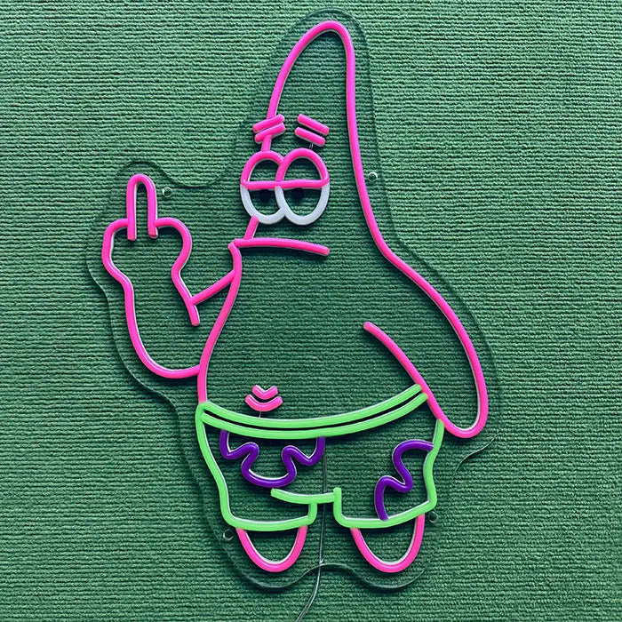 Patrick Middle Finger Neon LED Sign switched off on a green surface, full outline visible