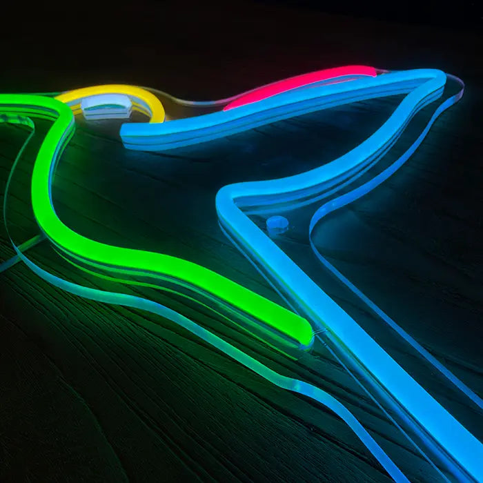 Hummingbird Bird Neon LED Sign in close-up, green beak and blue wing on clear acrylic