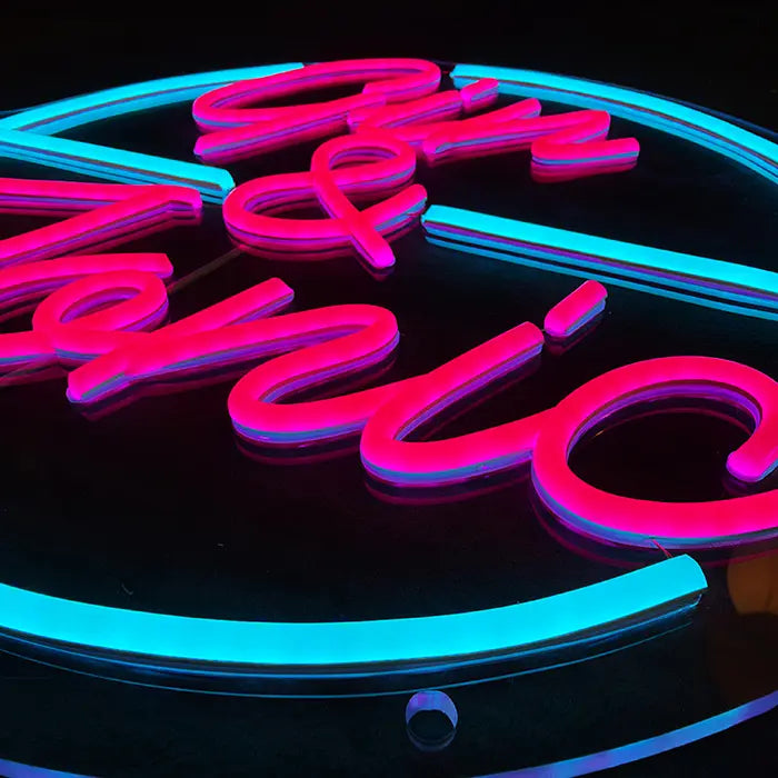 Gin & Tonic Neon LED Sign from above at an angle, pink letters and turquoise circle in detail