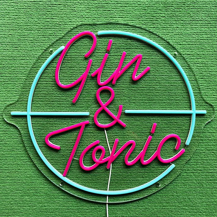 Gin & Tonic Neon LED Sign switched off on a green surface, full outline visible