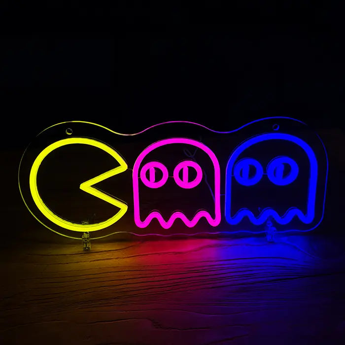 Retro Ghosts Neon LED Sign front view on a dark wall, yellow arcade figure chasing a pink and a blue ghost