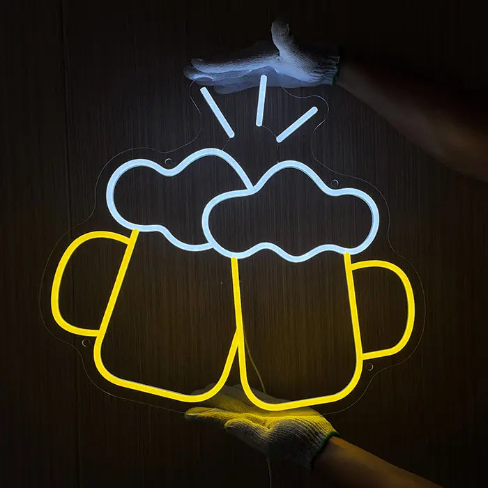 Beer Steins Neon LED Sign being held against a wooden wall with gloves and lined up