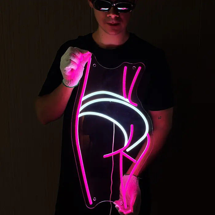 Sexy Boogie Neon LED Sign held in front of the body with gloves