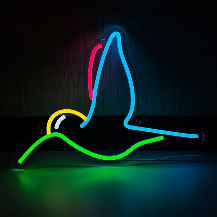 Hummingbird Bird Neon LED Sign front view against a dark wall, hummingbird in blue, green, yellow and red