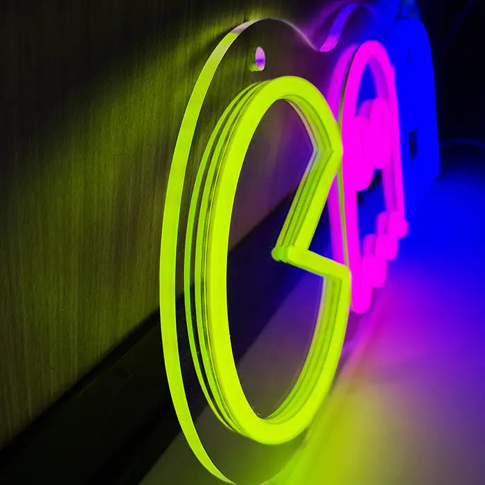 Retro Ghosts Neon LED Sign from the side on the wall, yellow figure and acrylic edge up close