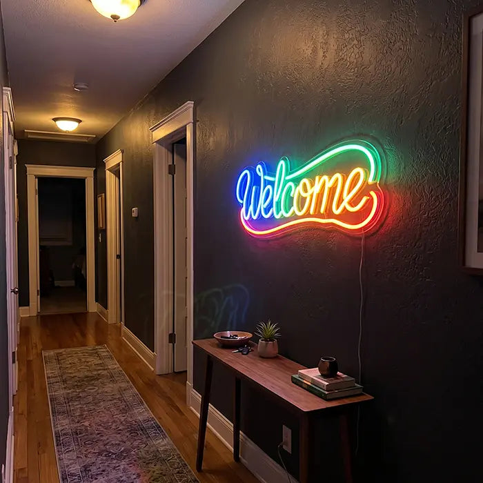 Welcome Neon LED Sign on a hallway wall above a console table