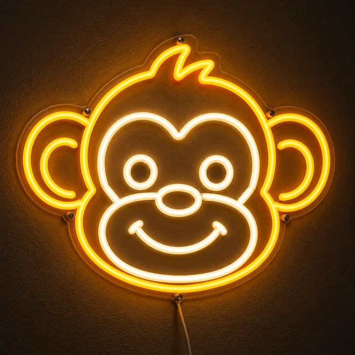 Monkey Face Neon LED Sign glowing on a dark wall, close-up with connection cable