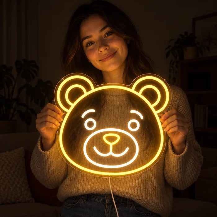 Bear Smile Neon LED Sign held by a smiling woman against a dark background