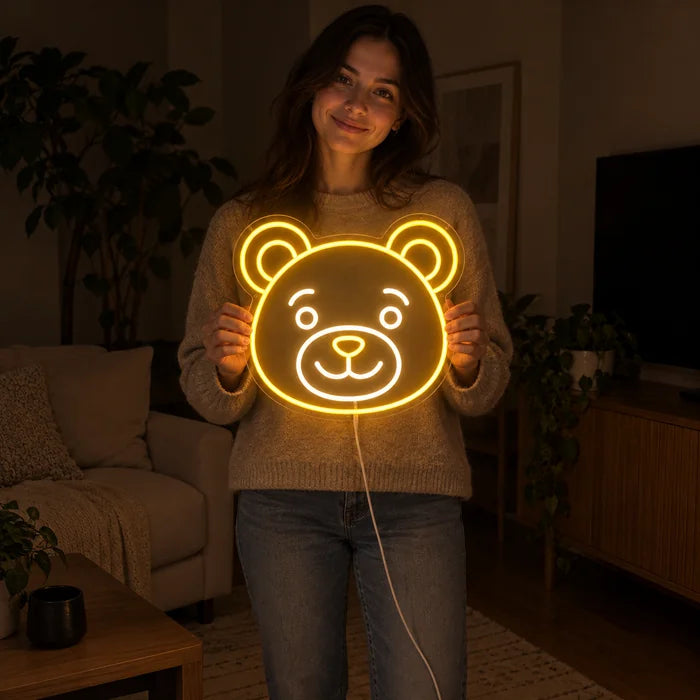 Bear Smile Neon LED Sign held by a woman, showing its size compared to her body