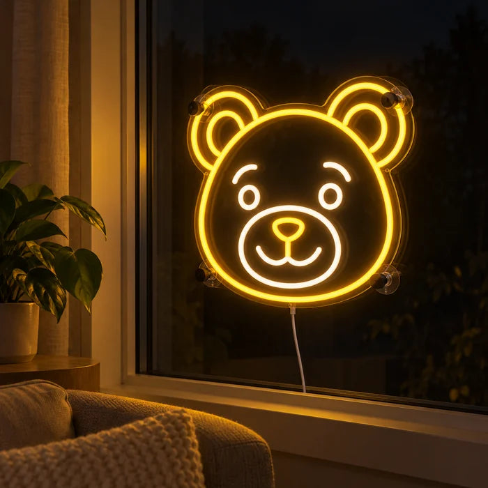 Bear Smile Neon LED Sign in the window of a cosy living room in the evening