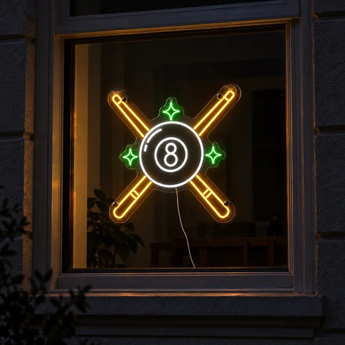 Crossed Pool Cues Neon LED Sign in a window, seen from the street at night
