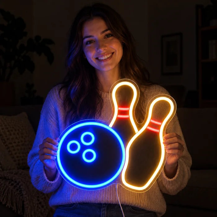 Bowling Night Neon LED Sign held by a smiling woman against a dark background