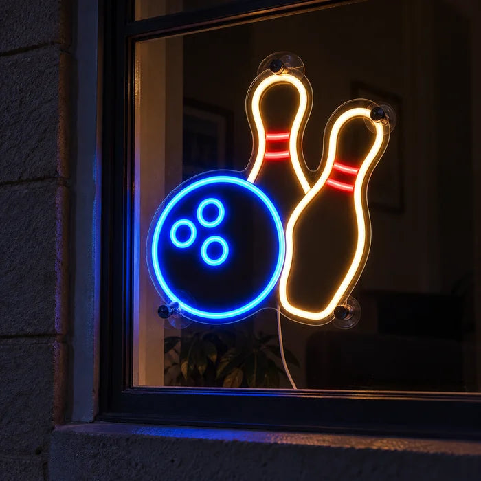 Bowling Night Neon LED Sign in a window, seen from the street at night