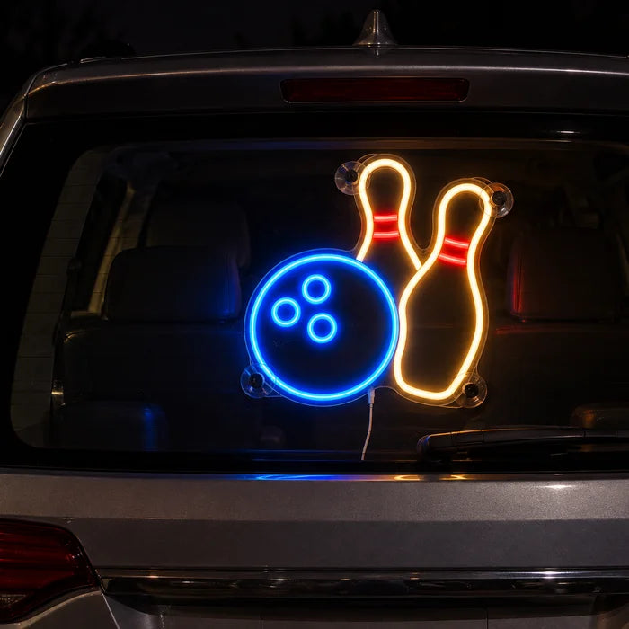 Bowling Night Neon LED Sign on the rear window of a car at night