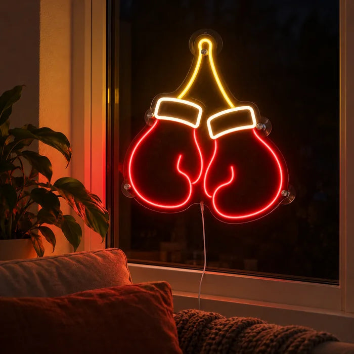 Boxing Gloves Neon LED Sign in the window of a cosy living room in the evening