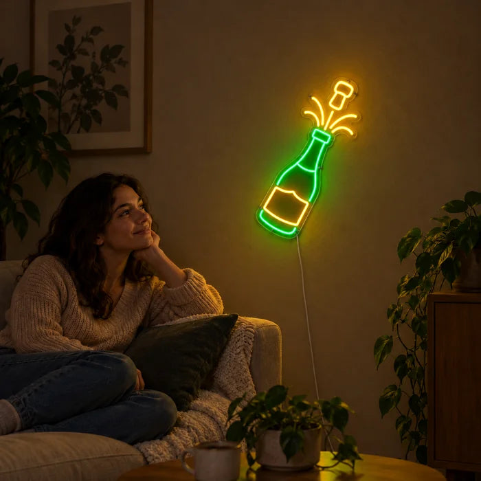 Champagne Neon LED Sign on a living room wall, a person relaxing on the sofa in front of it