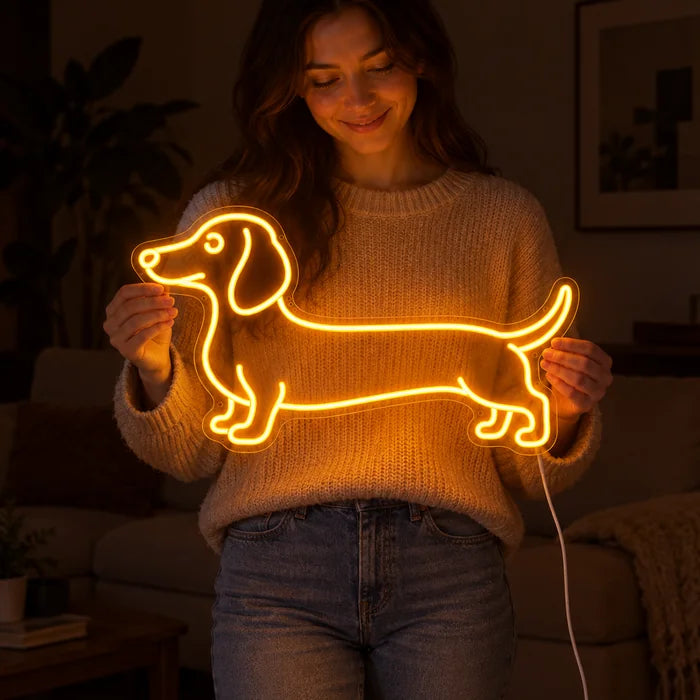 Dachshund Neon LED Sign held by a woman, showing its size compared to her body