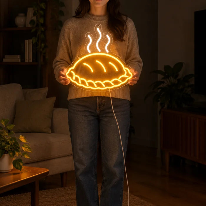 Steaming Dumpling Neon LED Sign held by a woman, showing its size compared to her body