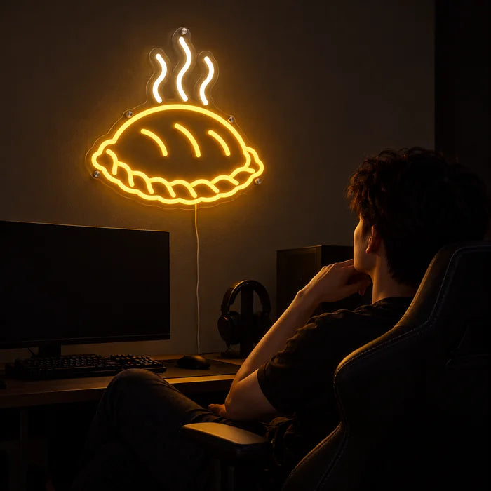 Steaming Dumpling Neon LED Sign above a gaming desk, a gamer in a gaming chair in front of it