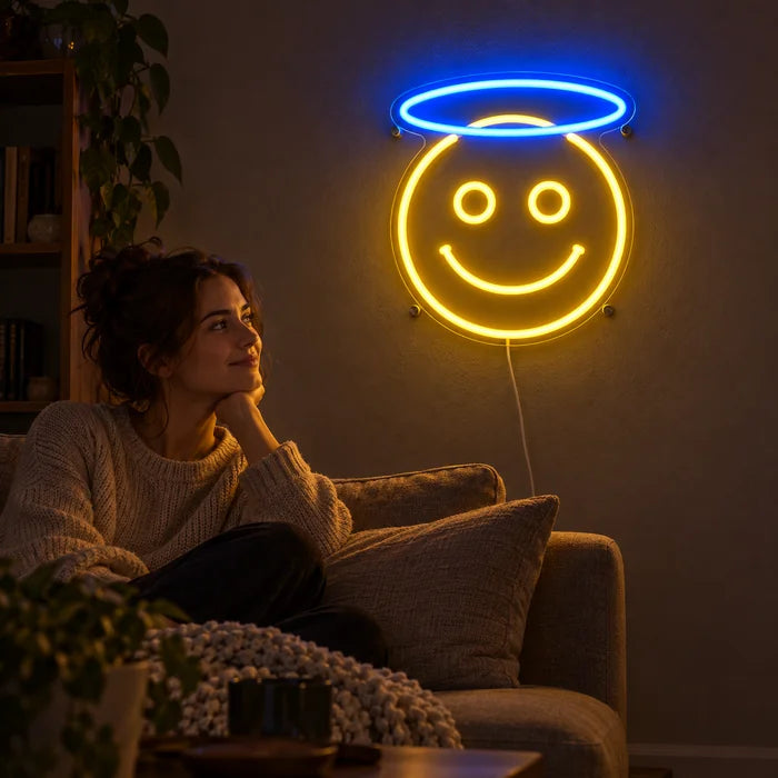 Angel Smiley Neon LED Sign on a living room wall, a person relaxing on the sofa in front of it