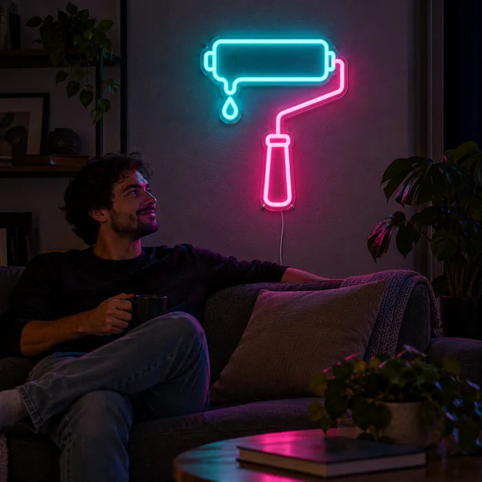 Paint Roller Neon LED Sign on a living room wall, a person relaxing on the sofa in front of it