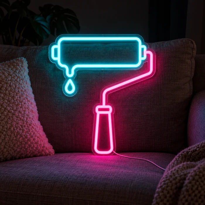 Paint Roller Neon LED Sign on a cosy sofa between cushions and a throw