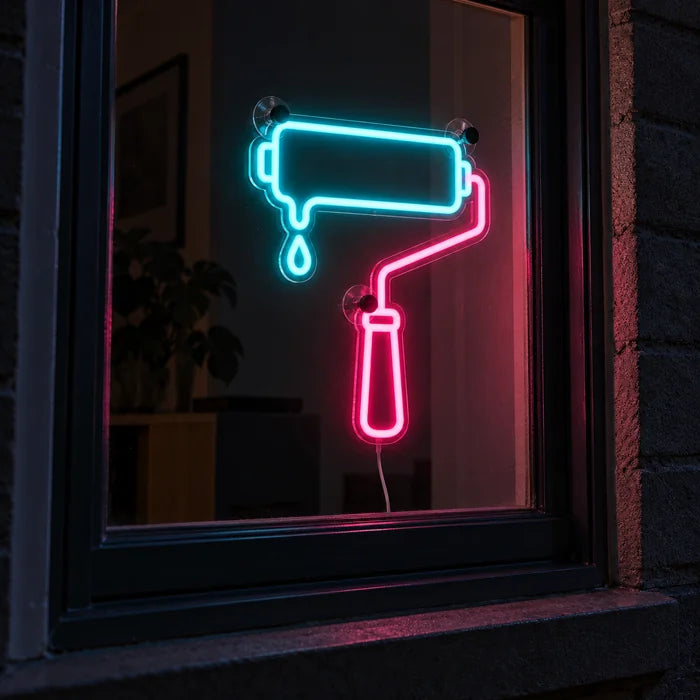 Paint Roller Neon LED Sign in a window, seen from the street at night
