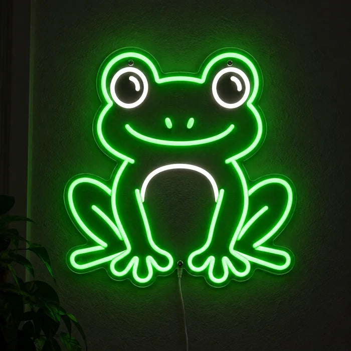 Frog Friend Neon LED Sign glowing on a dark wall, close-up with connection cable