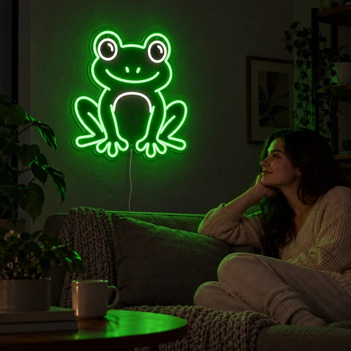 Frog Friend Neon LED Sign on a living room wall, a person relaxing on the sofa in front of it